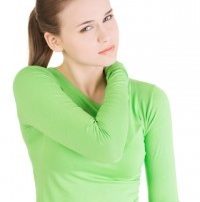 A picture of a woman holding her shoulder in pain following an injury.